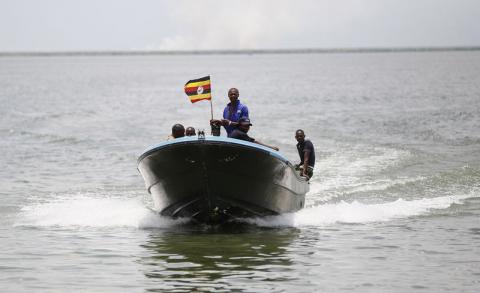 Members of the Uganda Police Marine Unit sail to the shores of Lake Albert. PHOTO BY REUTERS/Thomas Mukoya