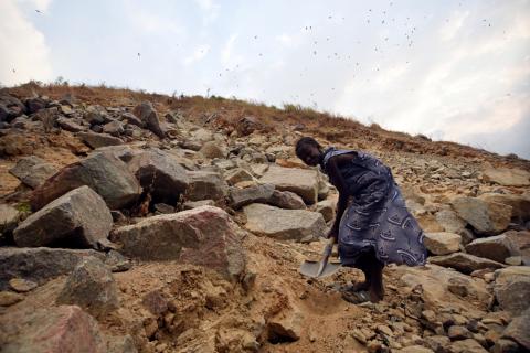 A girl, living near the Octea diamond mine, sifts through the mine's slag for stones that her family can sell to a local concrete company, in Koidu, Sierra Leone, March 21, 2019. PHOTO BY REUTERS/Cooper Inveen