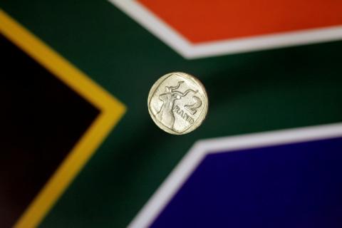 Illustration photo shows a two-rand coin above a South Africa flag April 12, 2017. REUTERS/Thomas White/Illustration