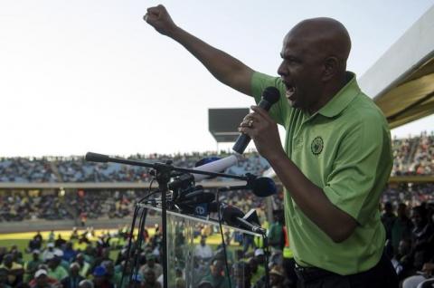 The Association of Mineworkers and Construction Union (AMCU) President Joseph Mathunjwa speaks to striking mine workers at the Royal Bafokeng Stadium in Rustenburg, June 23, 2014. PHOTO BY REUTERS/Skyler Reid