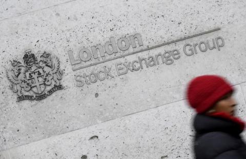 A woman walks past the London Stock Exchange building in the City of London, Britain, January 16 , 2017. PHOTO BY REUTERS/Toby Melville