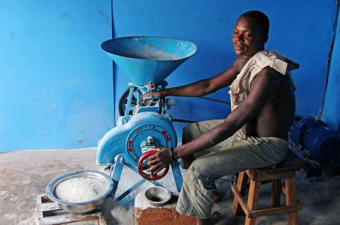 A man works on a solar powered milling machine in Sikpe Afidegnon village, Togo, May 16, 2019. PHOTO BY REUTERS/Noel Kokou Tadegnon