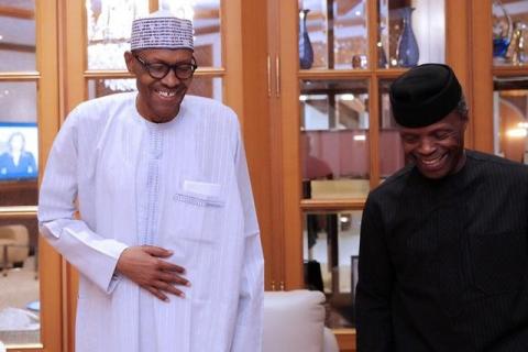 Nigerian President Muhammadu Buhari (L) smiles next to his deputy Yemi Osibanjo in Abuja, Nigeria, May 7, 2017. PHOTO BY REUTERS/Bayo Omoboriowo/Presidential office