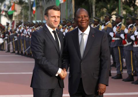 France's President Emmanuel Macron is welcomed by Ivory Coast President Alassane Ouattara. PHOTO BY REUTERS/Luc Gnago