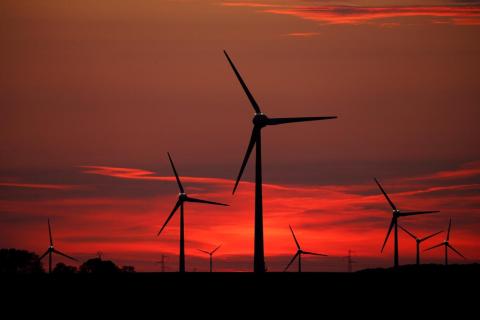 Power-generating windmill turbines are pictured at sunset at a wind park in Cagnicourt near Cambrai, France, May 22, 2019. PHOTO BY REUTERS/Pascal Rossignol