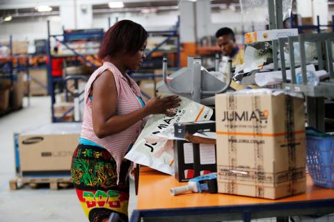 A woman works at the packaging unit at a warehouse for an online store, Jumia in Ikeja district, in Nigeria's commercial capital Lagos, June 10, 2016. PHOTO BY REUTERS/Akintunde Akinleye