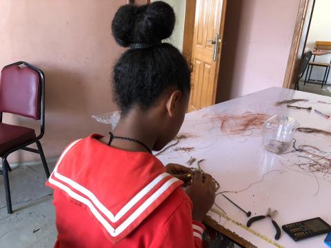 A woman rescued from prostitution makes jewellery from bullet casings at Ethiopian social enterprise Ellilta Products in Addis Ababa,October 22, 2019. PHOTO BY THOMSON REUTERS FOUNDATION/Belinda Goldsmith