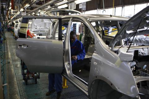 A worker assembles a car at a Nissan's manufacturing plant in Rosslyn, outside Pretoria. PHOTO BY REUTERS/Siphiwe Sibeko