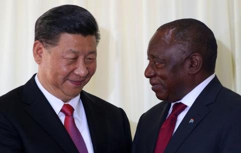 China's President Xi Jinping talks with South African President Cyril Ramaphosa after their media conference in Pretoria, South Africa, July 24, 2018. PHOTO BY REUTERS/Mike Hutchings