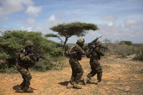 Kenya Defence Forces (KDF) Rangers, who are part of the African Mission in Somalia (AMISOM), secure an area during a foot patrol on the outskirts of the controlled area of the old airport in the coastal town of Kismayu in southern Somalia, November 12, 2013. PHOTO BY REUTERS/Siegfried Modola