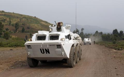 U.N. peacekeepers drive in their armoured personnel carrier (APC) as they patrol the road towards Kibati, outside Goma in the eastern Democratic Republic of Congo