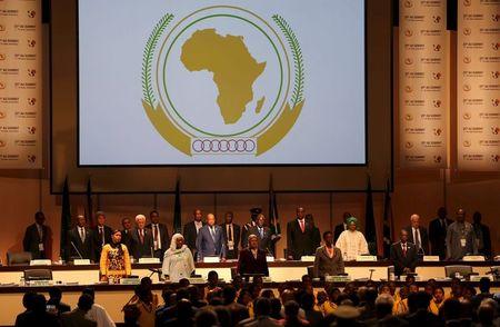 Leaders of the AU stand during the opening of the 25th African Union summit in Johannesburg, June 14, 2015. PHOTO BY REUTERS/Siphiwe Sibeko