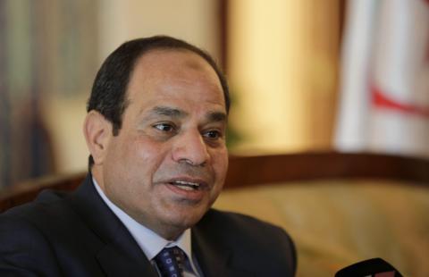 Egypt's President Abdel Fattah al-Sisi answers a question upon his arrival at Algiers airport