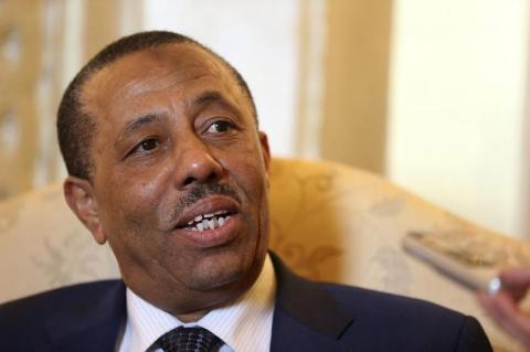 Libya's Prime Minister Abdullah al-Thinni speaks to reporters in Abu Dhabi