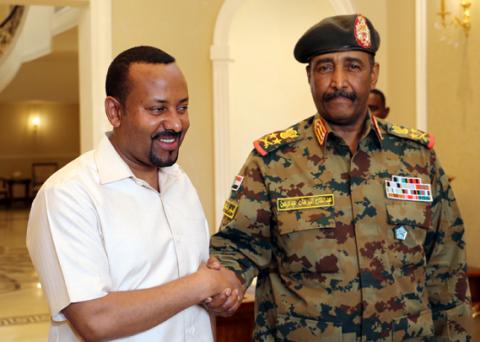 Ethiopian Prime Minister Abiy Ahmed meets Sudan's Head Of Transitional Military Council, Lieutenant General Abdel Fattah Al-Burhan Abdelrahman to mediate in the political crisis that has followed the overthrow of President Omar al-Bashir at the airport in Khartoum, Sudan, June 7, 2019. PHOTO BY REUTERS/Mohamed Nureldin Abdallah