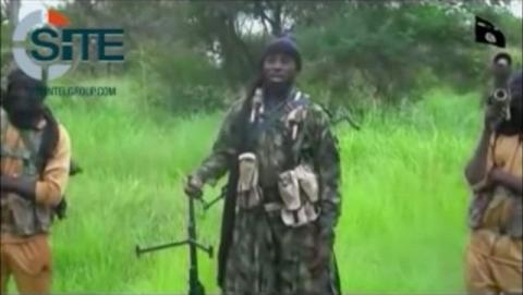 A man purporting to be Boko Haram's leader Abubakar Shekau (C) speaks in this still frame taken from social media video courtesy of SITE Intel Group. PHOTO BY REUTERS/SITE INTEL GROUP