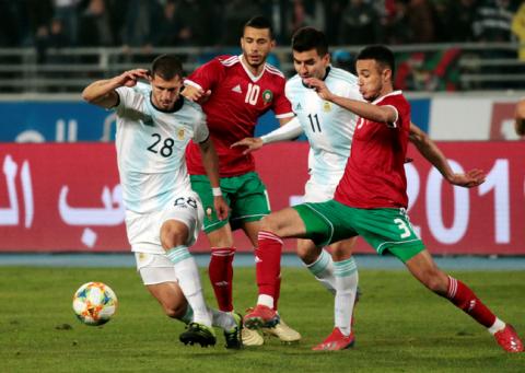 Argentina's Guido Rodriguez and Angel Correa in action with Morocco's Younes Belhanda and Noussair Mazraoui. PHOTO BY REUTERS/Youssef Boudlal