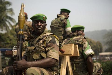 Soldiers from the African Union peacekeeping mission (MISCA) prepare to leave in a convoy at the end of a speech given by Alexandre-Ferdinand Nguendet, the head of Central African Republic's (CAR) transitional assembly (CNT