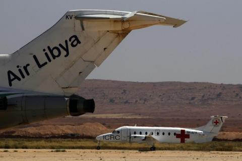 A Red Cross (ICRC) plane carrying five government soldiers captured during fights between insurgents and troops loyal to Muammar Gaddafi prepares to take off from Benghazi airport bound for Tripoli, April 30, 2011. PHOTO BY REUTERS/Yannis Behrakis