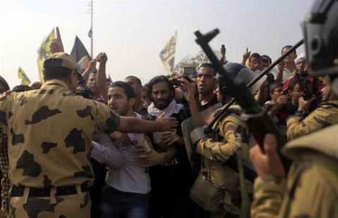 Al-Azhar University students, who are members of the Muslim Brotherhood and supporters of ousted Egyptian President Mohamed Mursi, shout slogans