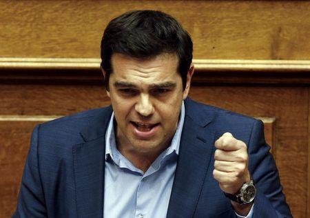 Greek Prime Minister Alexis Tsipras addresses lawmakers during a parliamentary session in Athens, Greece July 23, 2015. PHOTO BY REUTERS/Yiannis Kourtoglou 