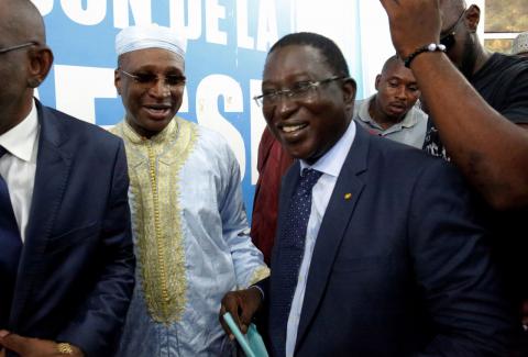 Soumaila Cisse, leader of opposition party URD (Union for the Republic and Democracy), walks with Aliou Diallo, leader of the Democratic Alliance for Peace (Alliance Democratique pour la Paix, or ADP-MALIBA) party, after attending a joint news conference of opposition candidates in Mali's presidential election in Bamako, Mali, August 1, 2018. PHOTO BY REUTERS/Luc Gna