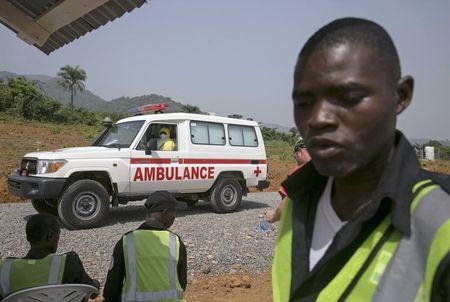 An ambulance transporting a newly admitted Ebola patient drives to the entrance of the Save the Children Kerry Town Ebola treatment centre outside Freetown, Sierra Leone, December 22, 2014. PHOTO BY REUTERS/Baz Ratner