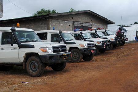 Ambulances are parked in Nedowein, Liberia, July 10, 2015. PHOTO BY REUTERS/James Giahyue