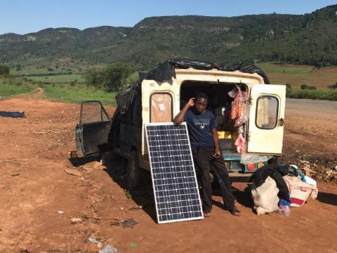 After losing his shop and his home to recent floods, Amos Myambo and his family are living in a van on a roadside outside Chipinge town, Zimbabwe, March 22, 2019. PHOTO BY Thomson Reuters Foundation/Ray Mwareya