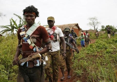 Members of the anti-balaka, a Christian militia, patrol outside the village of Zawa, April 8, 2014. PHOTO BY REUTERS/Goran Tomasevic