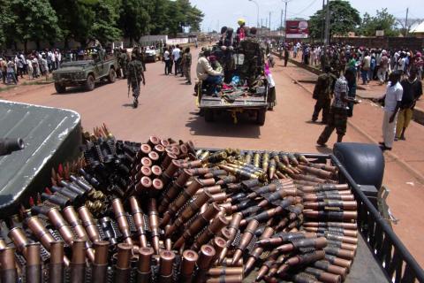 Armed fighters from the Seleka rebel alliance patrol the streets in pickup trucks to stop looting in Bangui