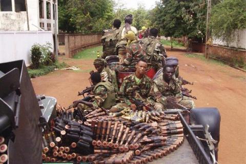 Armed fighters from the Seleka rebel alliance patrol the streets in pickup trucks to stop looting in Bangui