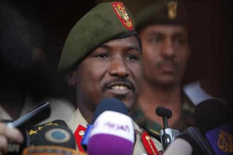 Sudanese Army spokesman Sawarmi Khaled Massar speak to the media upon arrival of four arrested foreigners at the military airport in Khartoum