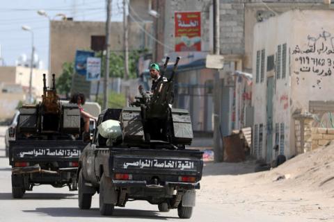 Members of Libyan internationally recognised pro-government forces ride in military vehicles on the outskirts of Tripoli, Libya, April 10, 2019. PHOTO BY REUTERS/Hani Amara