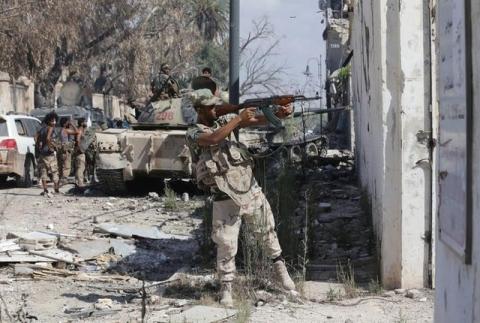 A member of Libyan National Army fires a weapon during clashes with Islamist militants in the militants' last stronghold in Benghazi, Libya, July 6, 2017. PHOTO BY REUTERS/Esam Omran Al-Fetori