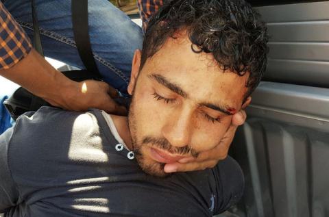 A security personnel detains the man who stabbed two German tourists to death and wounded four others during an attack at the Zahabia hotel resort in Hurghada, south of the capital Cairo, Egypt, July 14, 2017. PHOTO BY REUTERS/Mohamed Aly