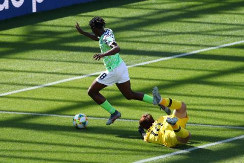 Nigeria's Asisat Oshoala scores their second goal. PHOTO BY REUTERS/Denis Balibouse