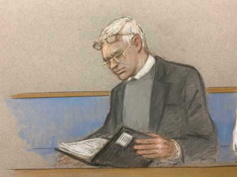 Julian Assange wearing two pair of glasses in seen at court during a hearing to decide whether he should be extradited to the United States, in London, February 24, 2020 in this courtroom sketch. PHOTO BY REUTERS/Julia Quenzler