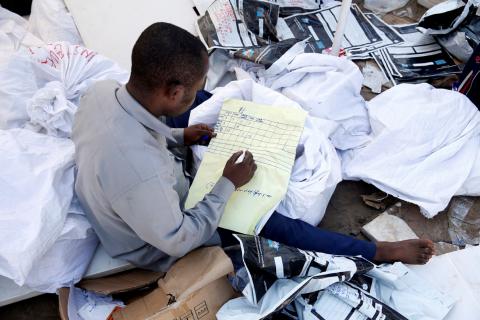 A man examines voting materials at Congo's Independent National Electoral Commission (CENI) tallying centre in Kinshasa, Democratic Republic of Congo, January 1, 2019. PHOTO BY REUTERS/Baz Ratner