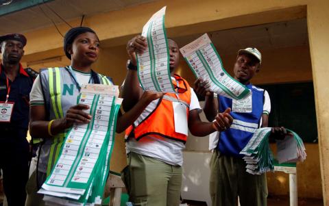 A member of the security forces watches as ballot papers are sorted during Nigeria's presidential election in Abuja, Nigeria, February 23, 2019. PHOTO BY REUTERS/Gbemileke Awodoye