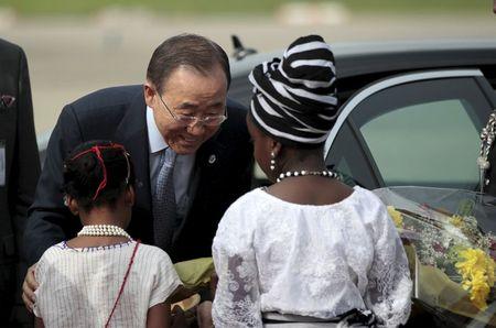 U.N. Secretary General Ban Ki-moon receives a bouquet of flowers on arrival at the Presidential wing of the Nnamdi Azikiwe Ingternational airport during his visit to commemorate the Boko Haram bombing of his organization's headquarters and 500 days of the abduction of the 219 schoolgirls held by the extremists in Abuja, Nigeria August 23, 2015. PHOTO BY REUTERS/Afolabi Sotunde