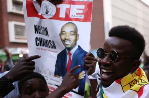 Supporters of the opposition Movement for Democratic Change party (MDC) of Nelson Chamisa, sing and dance in the street outside the party's headquarters following general elections in Harare, Zimbabwe, July 31, 2018. PHOTO BY REUTERS/Siphiwe Sibeko