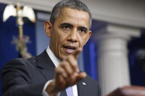 U.S. President Barack Obama addresses his year-end news conference in the White House briefing room in Washington