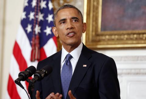 U.S. President Barack Obama talks about the humanitarian relief situation in Iraq, at the State Dining Room of the White House in Washington