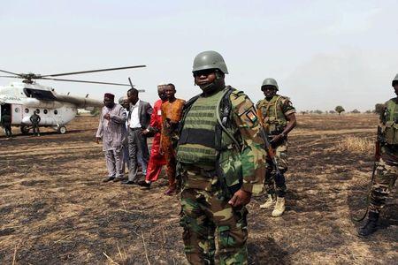 Colonel Barmou Salaou (C), commander of Niger's armed forces in the Diffa region, looks on after landing in Damasak, March 24, 2015. PHOTO BY REUTERS/Joe Penney