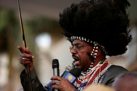 Sudan's President Omar Hassan al-Bashir, wearing a southern traditional dress. PHOTO BY REUTERS/Zohra Bensemra