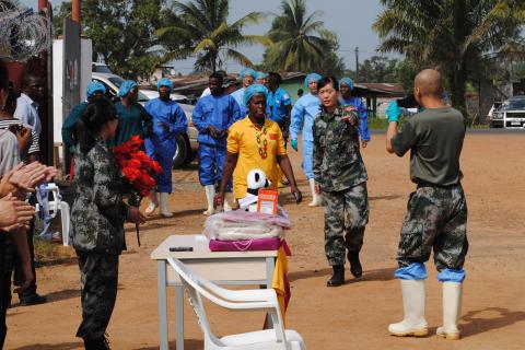 Liberia's last known Ebola patient Beatrice Yardolo (in yellow) arrives for a ceremony at the Chinese Ebola treatment unit, where she was treated, in Monrovia, Liberia, March 5, 2015. PHOTO BY REUTERS/James Giahyue