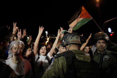 Israeli Arab protesters gesture during a demonstration showing solidarity with Bedouin Arabs who are against a government displacement plan for Bedouins in the Southern Negev desert