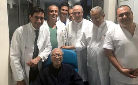 Tunisian President Beji Caid Essebsi is pictured surrounded by medical staff members in Tunis, in this handout pictured obtained by Reuters on July 1, 2019. PHOTO BY REUTERS/Tunisia Presidency