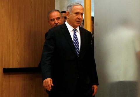 Israeli prime minister Benjamin Netanyahu (R) enters to a media conference together with Israel's new Defence Minister Avigdor Lieberman, head of far-right Yisrael Beitenu party, following Lieberman's swearing-in ceremony at the Knesset, the Israeli parliament, in Jerusalem, May 30, 2016. PHOTO BY REUTERS/Ronen Zvulun